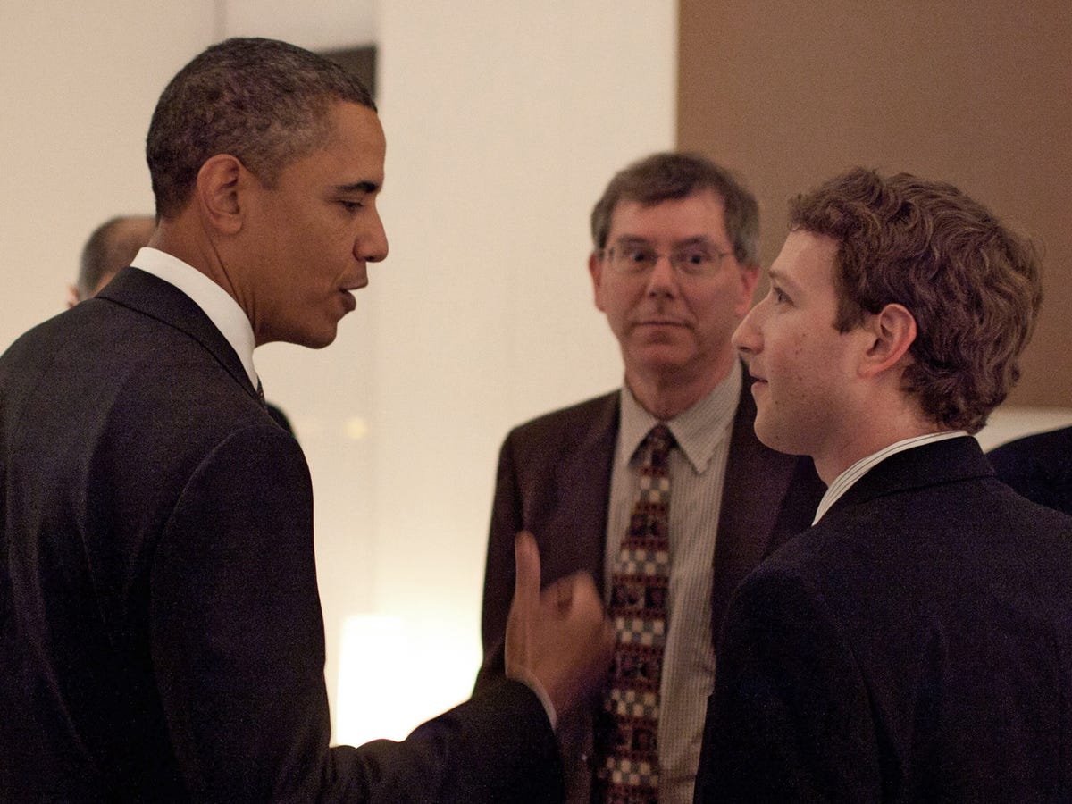 President Barack Obama talks with Facebook founder and CEO Mark Zuckerberg