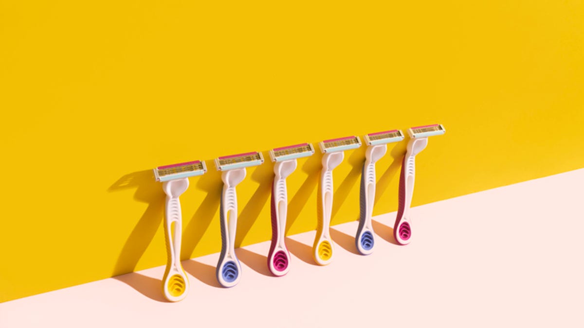 Line of razors against a yellow background.