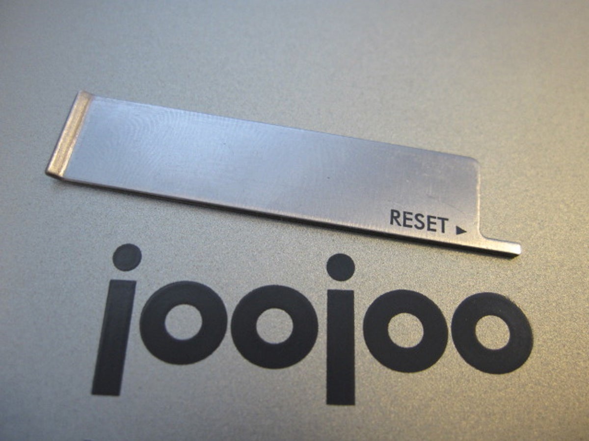 Photo of JooJoo logo next to reset tool.