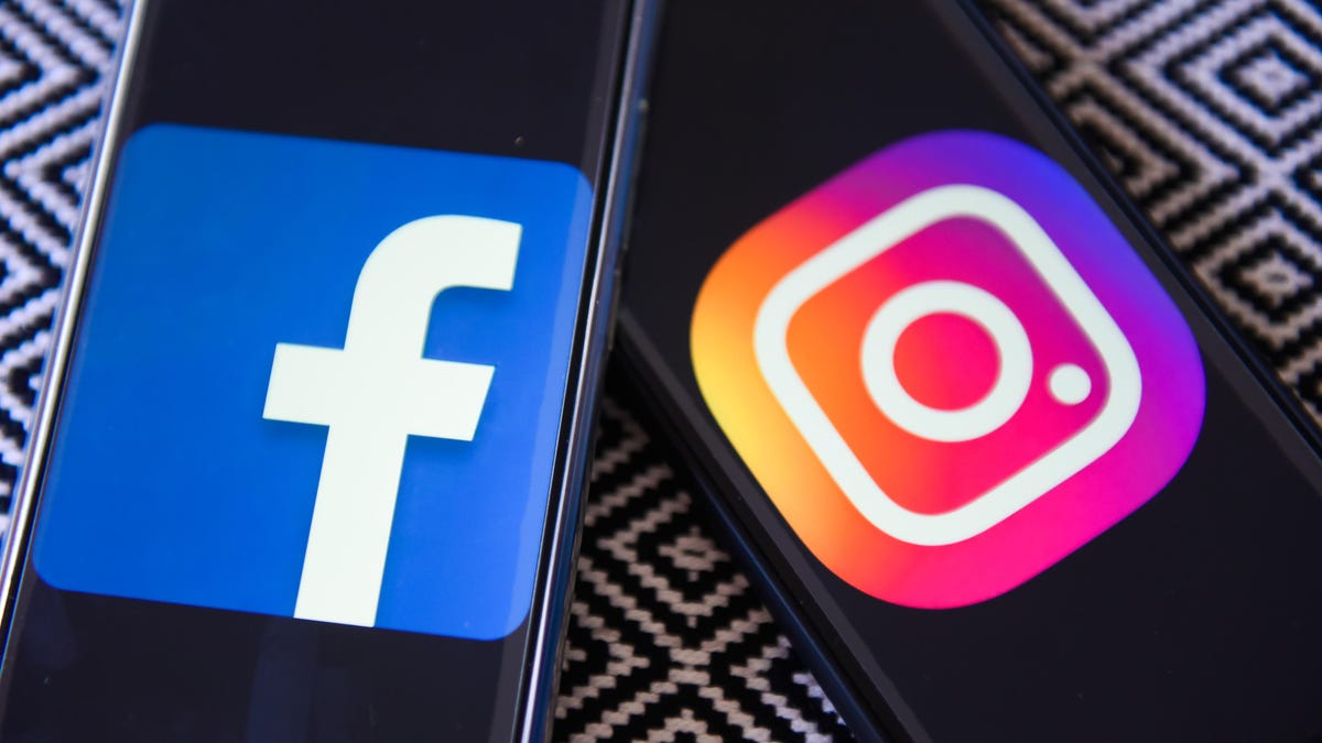 Facebook and Instagram logos are seen on a mobile phones
