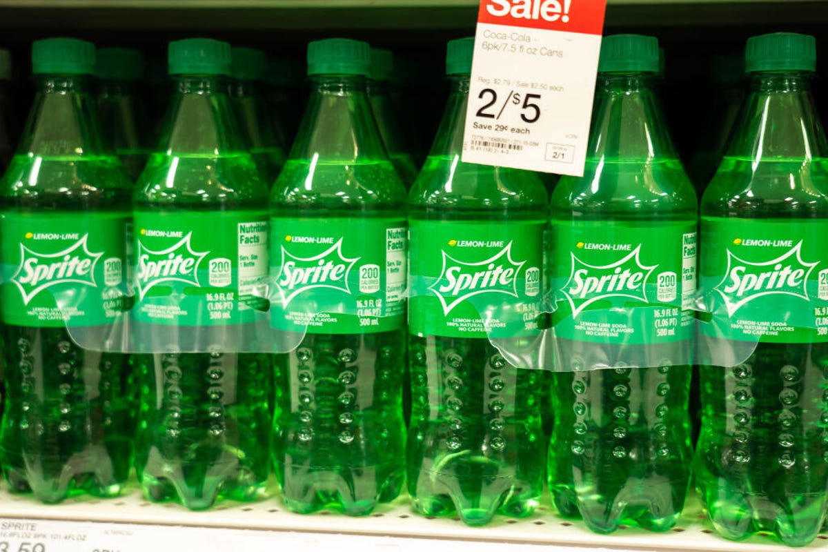 Bottles of Sprite on the shelf in a Target.
