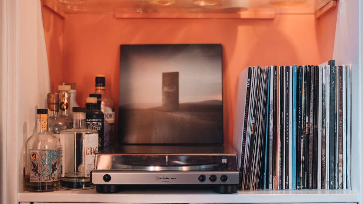 Image showing a vinyl record player and collection of records.