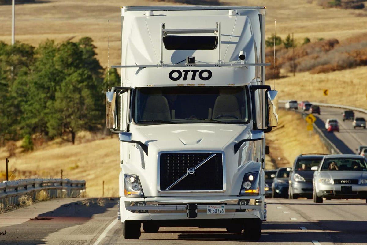 An Otto truck on a highway.