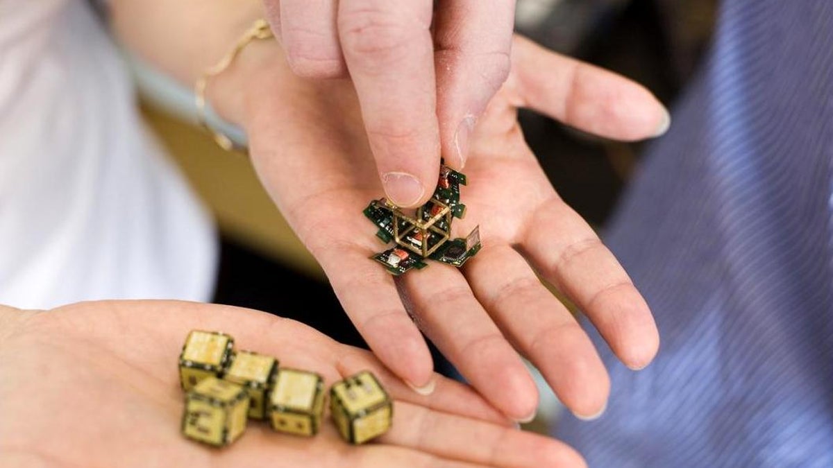 MIT researchers have developed pebble robots which can build an object from a model out of an unformed pile of these devices.