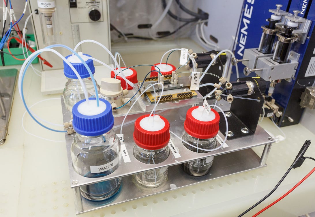 IBM can deliver up to 1 watt of power per square centimeter with this technology called a flow battery, which transports electrical power stored chemically. Here, vanadium electrolytes power a microfluidics chip in a lab demonstration. Ultimately IBM hopes to use liquids both to cool and power computers.