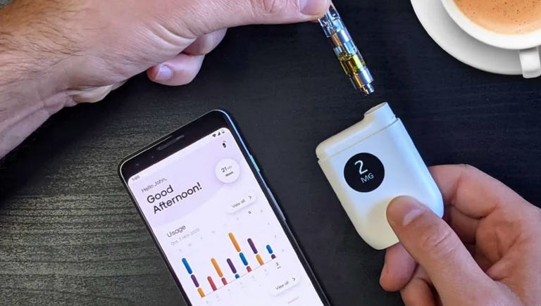 two hands holding different parts of the Mode precision dosing vape next to a phone showing the Mode app