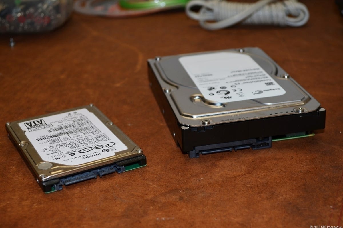 A 2.5-inch hard drive next to a 3.5-inch hard drive.