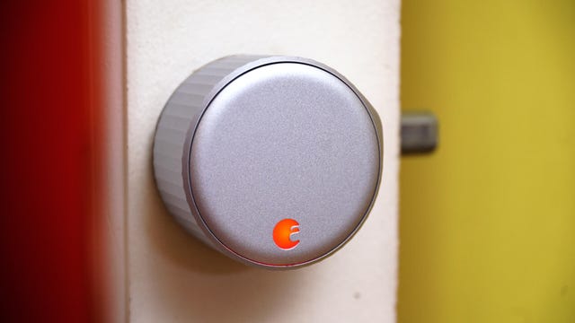 The August Wi-Fi Smart Lock installed in a white door.