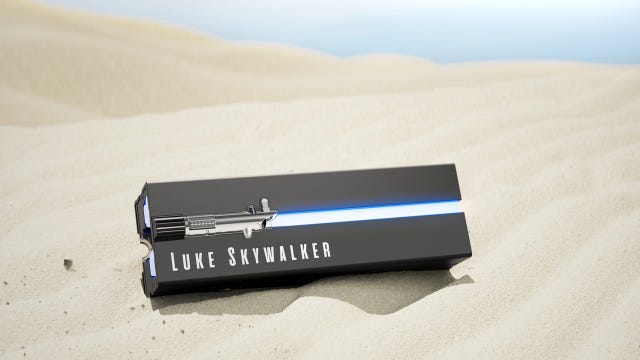 An SSD with a lightsaber on the side on a desert dune