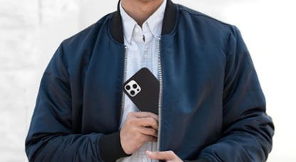 A Dad puts a phone covered in a Totallee case into his jacket pocket.