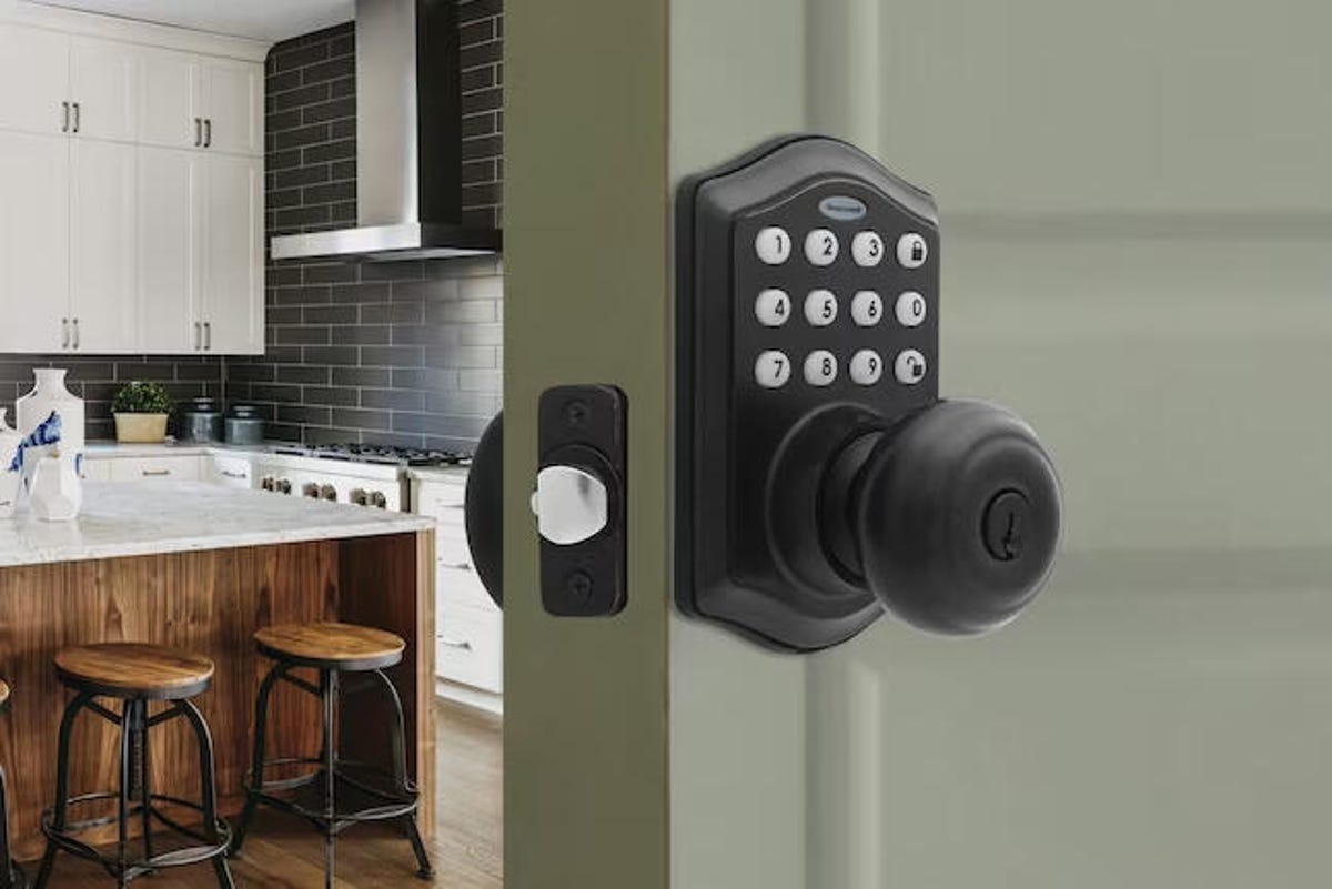 The Honeywell electric knob on a door leading into a kitchen.