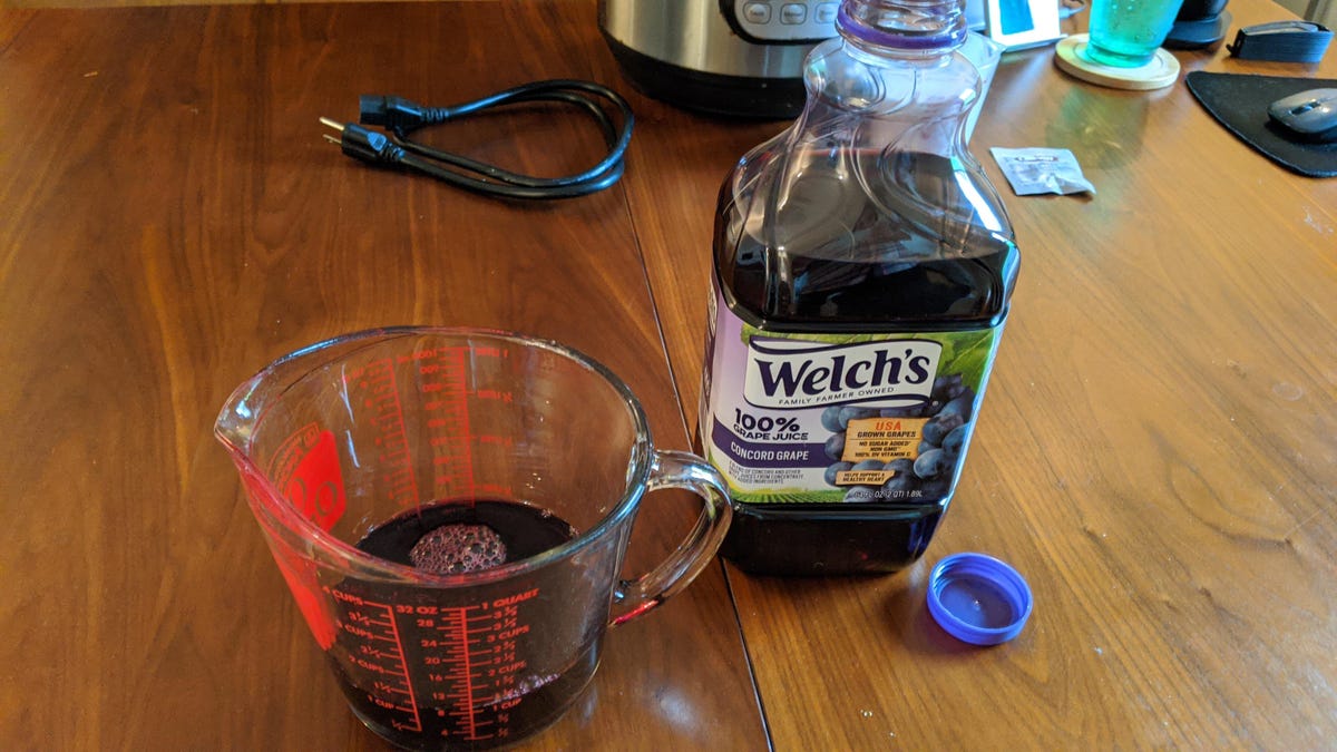 Bottle of grape juice on a table