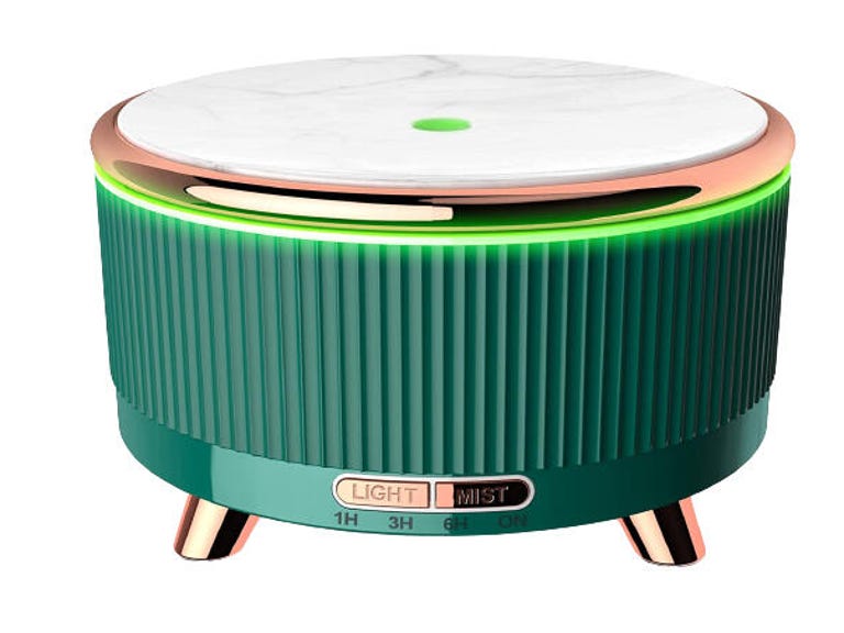 Small green oil diffuser with gold trim