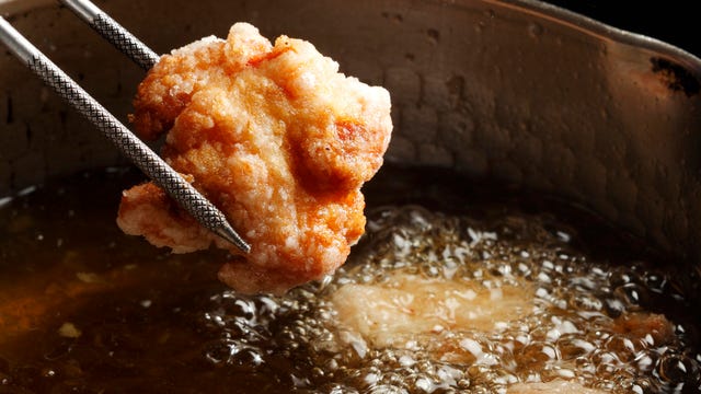 Japanese fried chicken Karaage being lifted