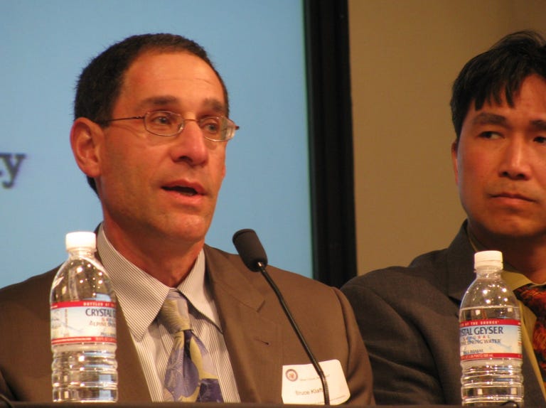 Bruce Klafter of Applied Materials and Steve Nguyen of Echelon. Most speakers declined to touch their bottled water, which Adobe and other tech companies are phasing out at their headquarters.