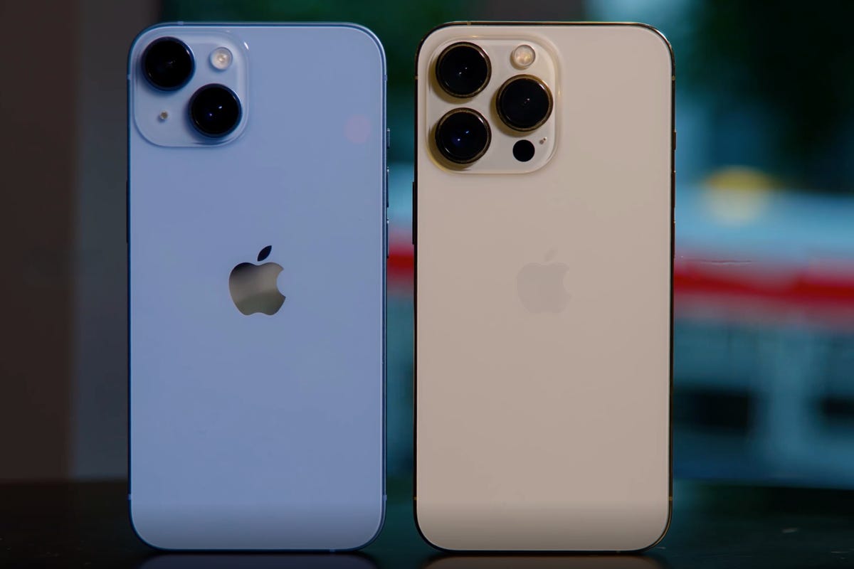 An iPhone 14 next to an iPhone 13 Pro