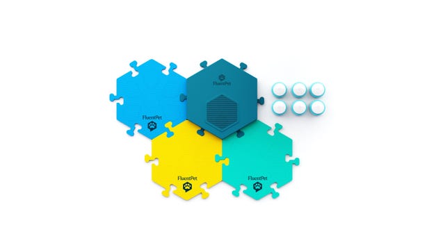 Four colored hex mats with six round buttons on the side