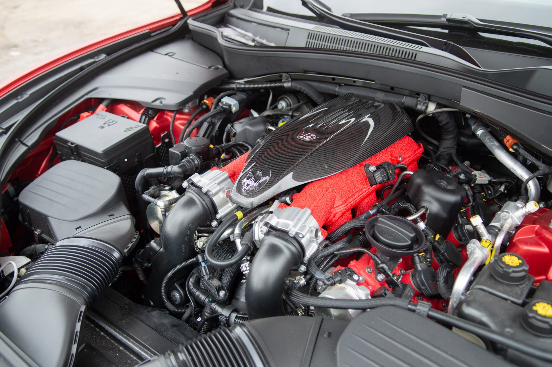 2022 Maserati Levante Trofeo, showing the engine bay and its many red elements