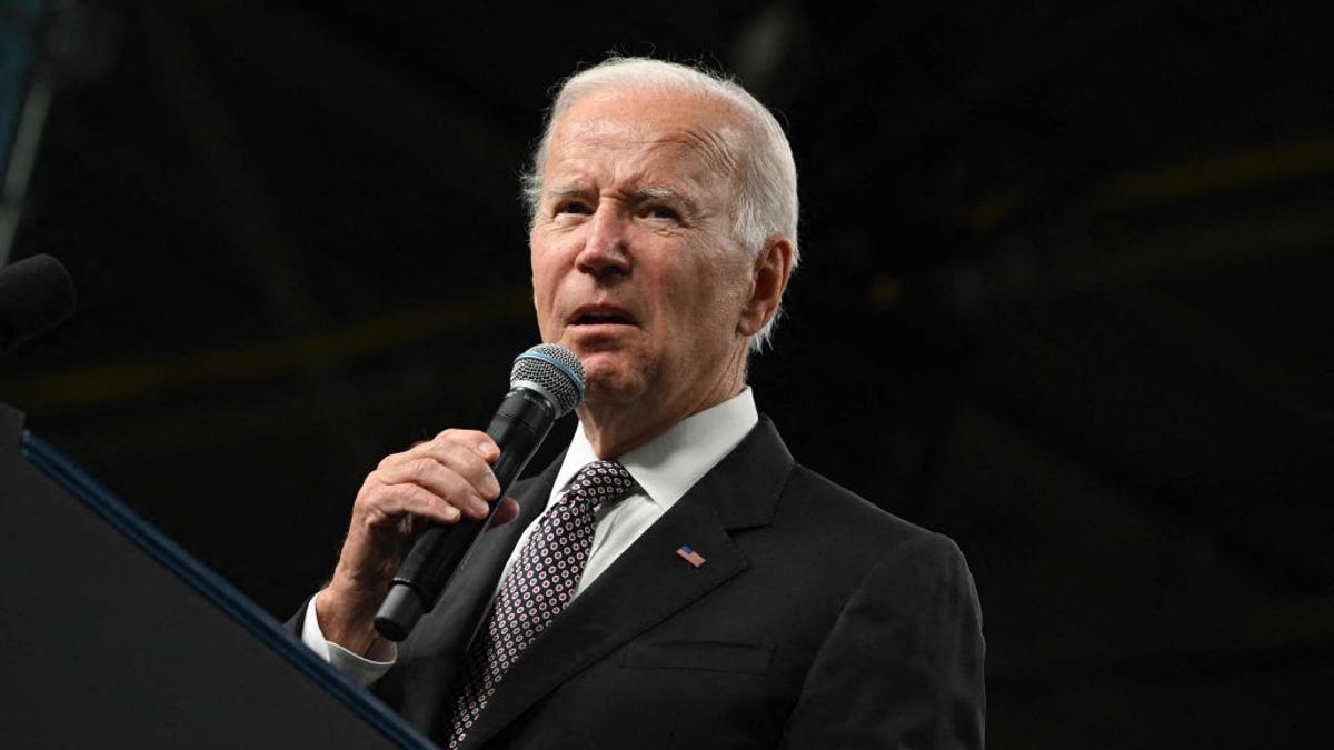 Joe Biden speaking into a microphone