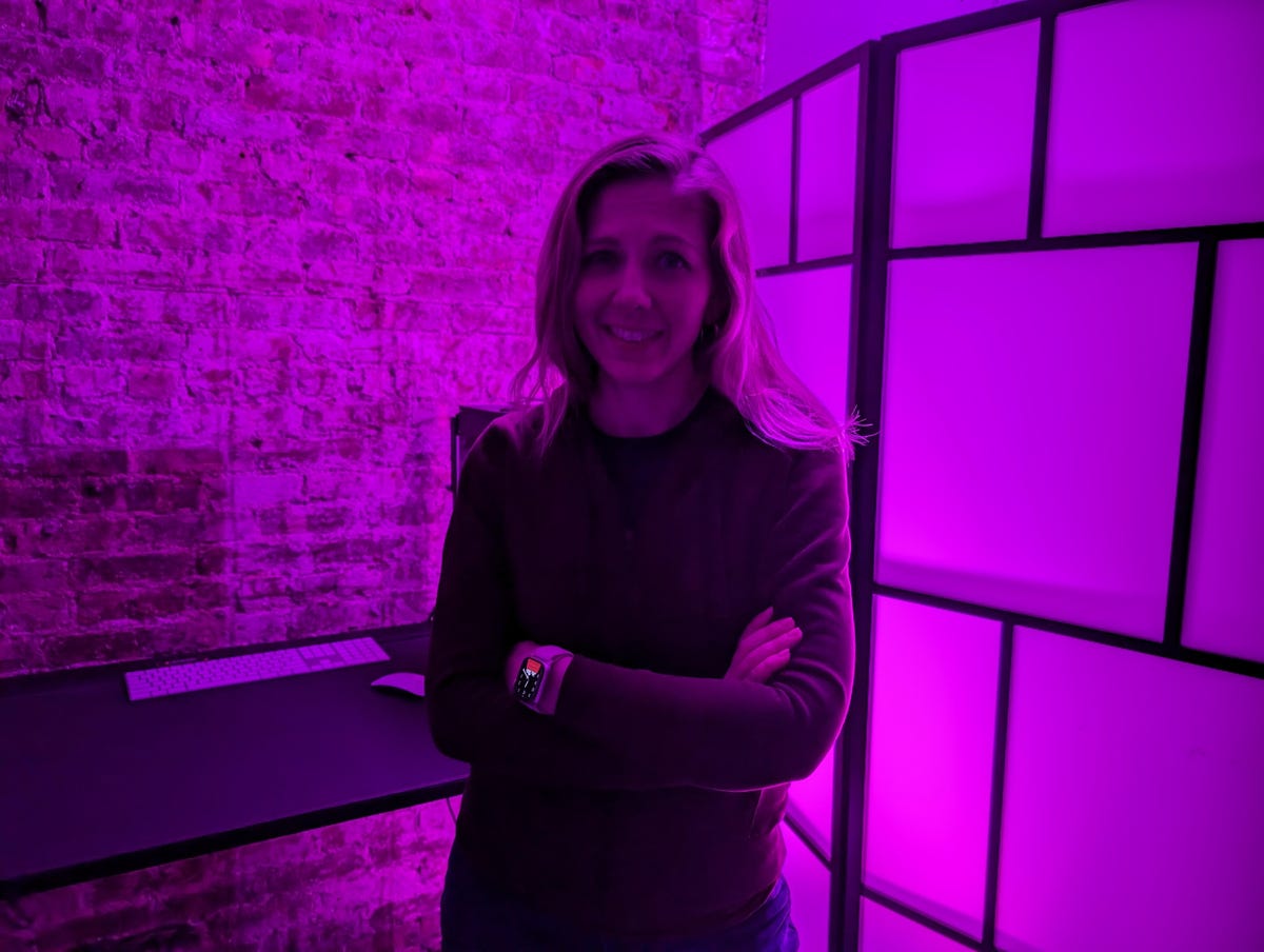 A photo of CNET's Bridget Carey in a dark room taken on the Pixel 8.