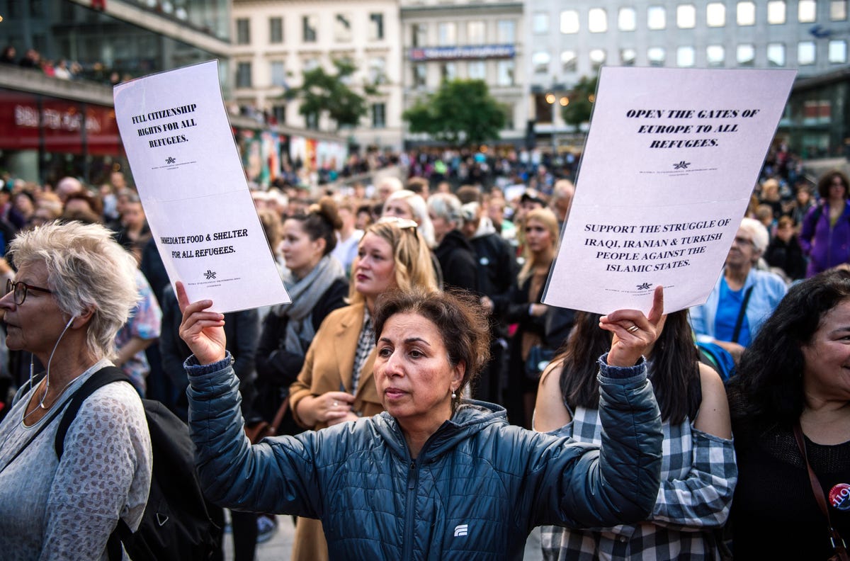In Stockholm last September, people take part in a demonstration to show solidarity with migrants who are seeking asylum in Europe after having fled their home countries.