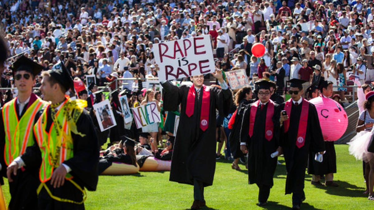 A student protests during Stanford&apos;s commencement ceremony earlier this month.