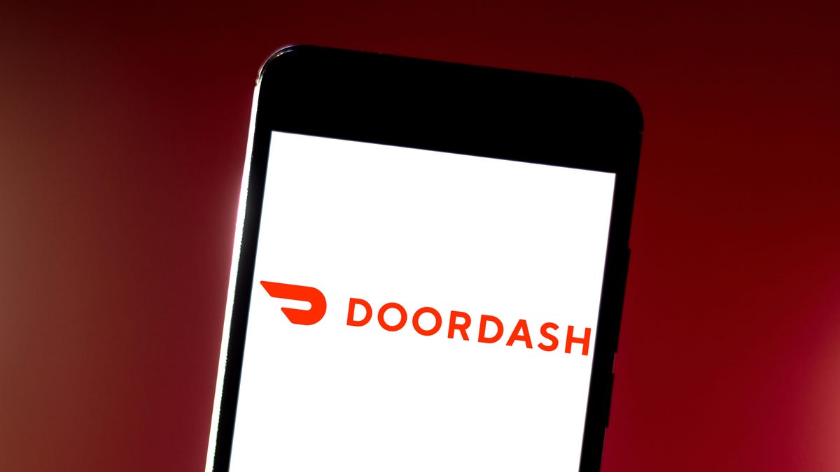 In this photo illustration the DoorDash logo is seen