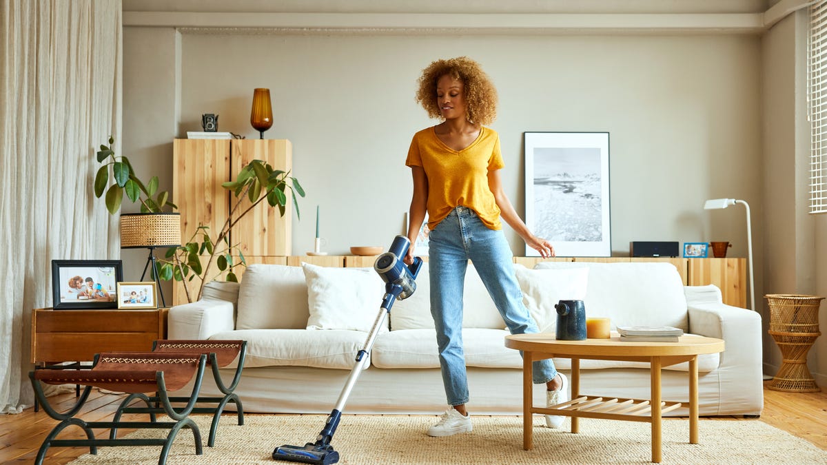 Women cleaning living room