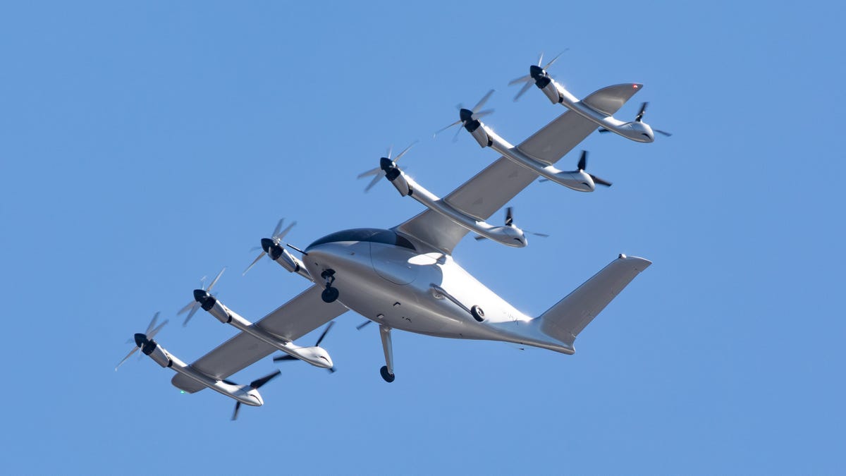 A dozen propellers mounted on the wing of Archer Aviation's Maker propel the company's electric aircraft on a test flight in Salinas, Calif.