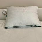 Brooklinen Marlow Pillow on a white bed