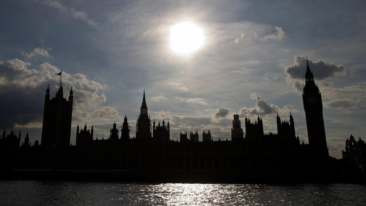 The Houses of Parliament silhouetted against a setting sun