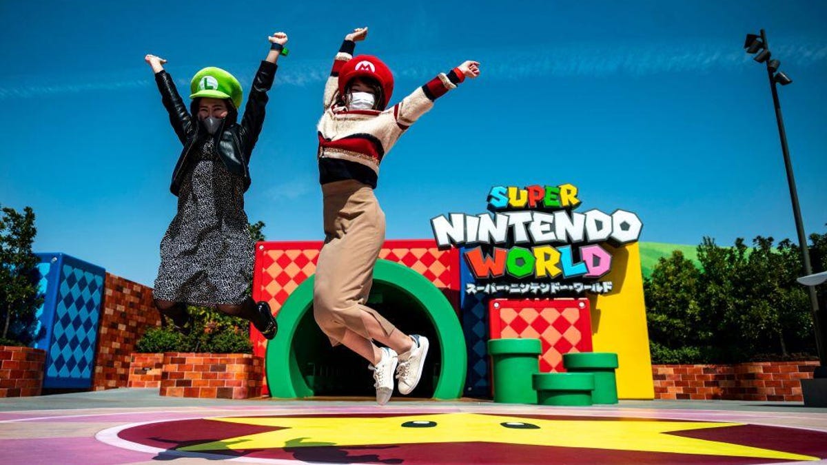 Two ladies jump at Super Nintendo World in Japan