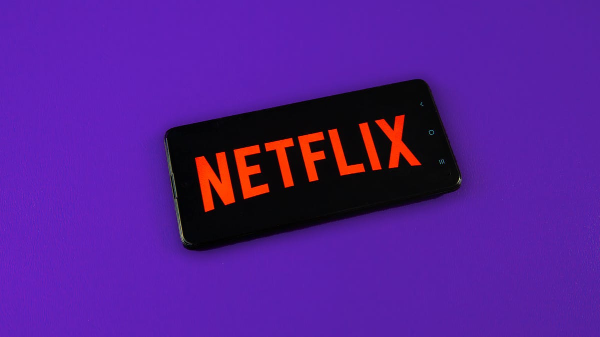 Netflix logo on a phone with purple background