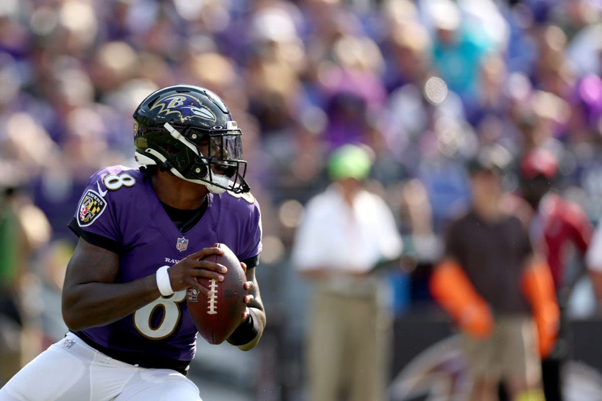 Baltimore Ravens' Lamar Jackson looks down