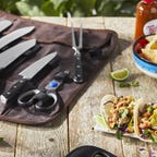knife set on table next to tacos