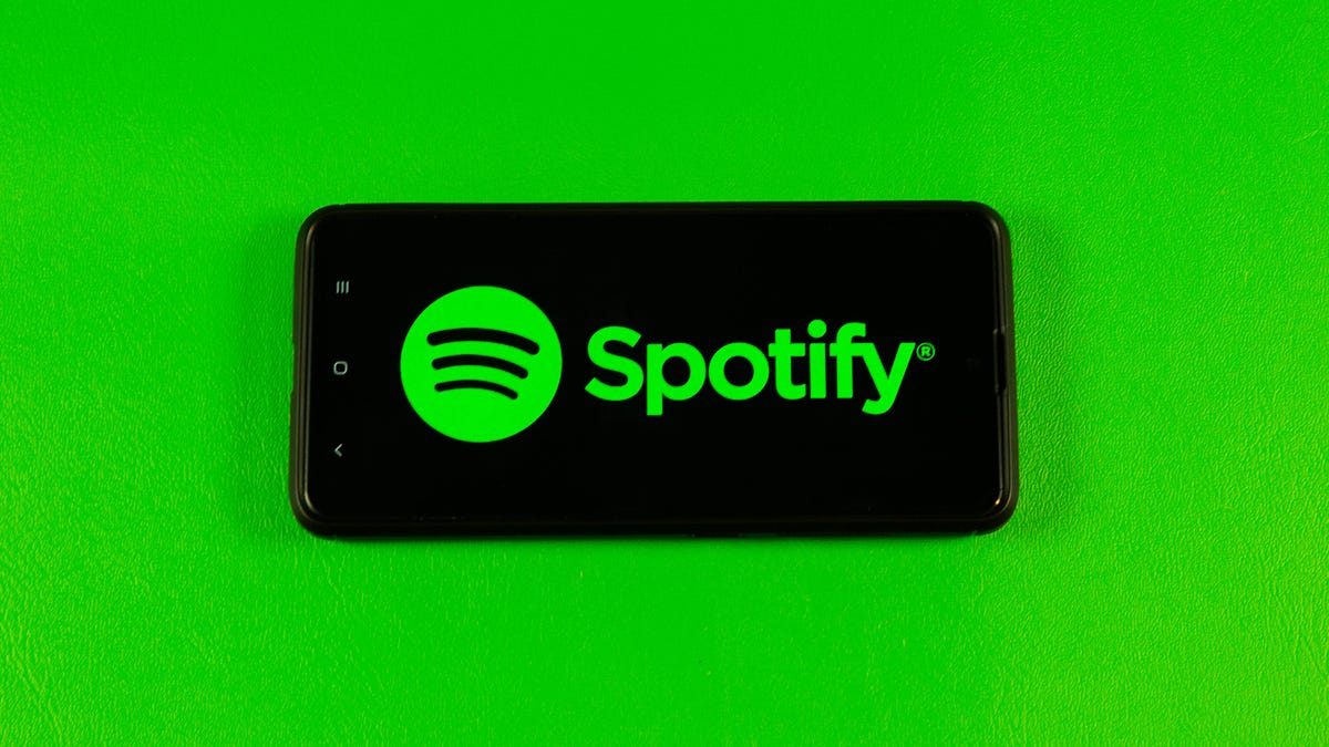 Spotify's logo on a phone