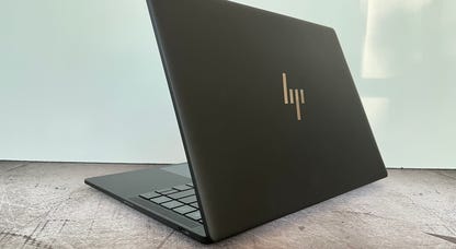 HP Dragonfly Pro in front of a gray wall