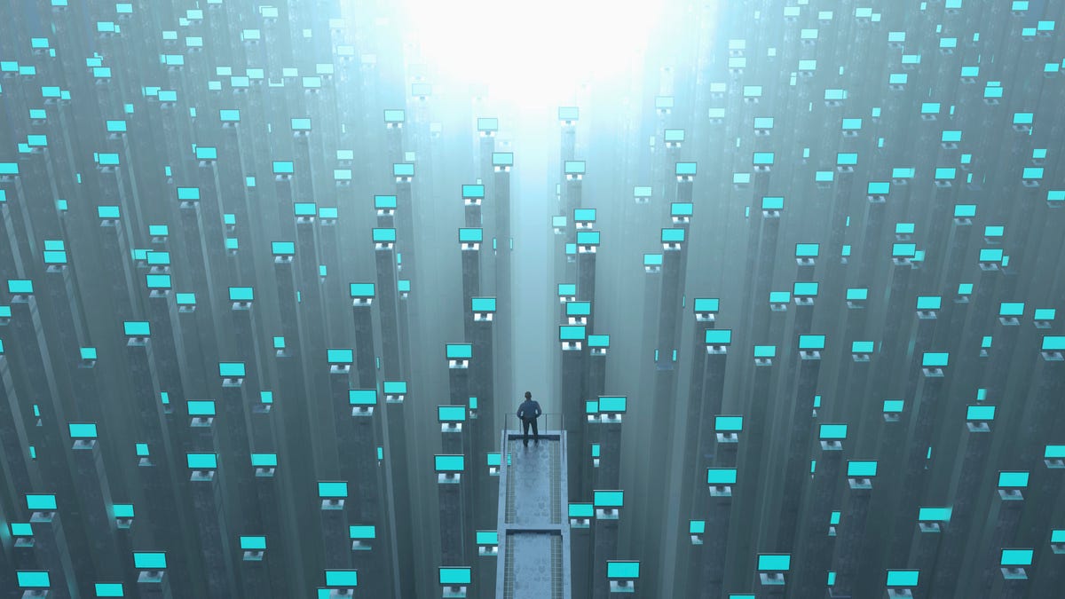 Illustration of a person amid dozens of computer screens