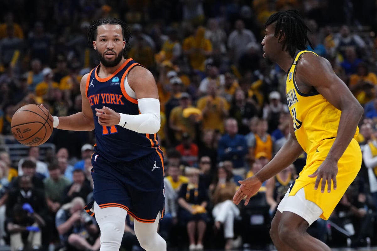 Jalen Brunson #11 of the New York Knicks drives the ball up the court around Aaron Nesmith #23 of the Indiana Pacers in Game Four of the Eastern Conference Second Round Playoff