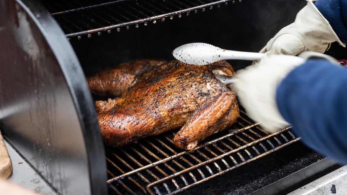 turkey pulling out of a Traeger grill 