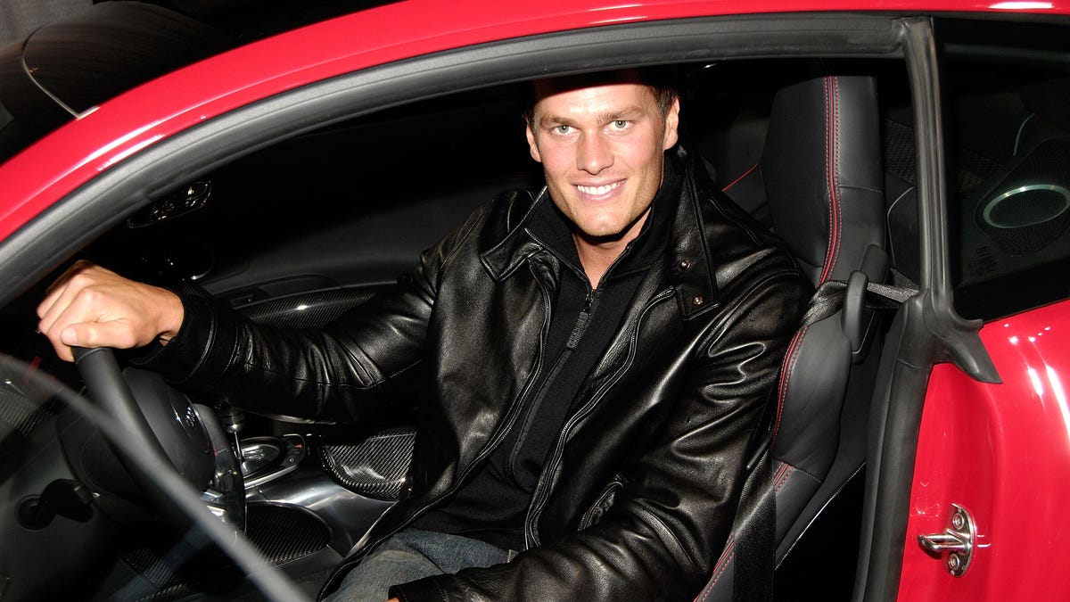 Tom Brady sitting in a car