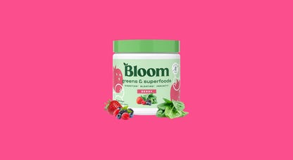 Bloom Greens & Superfoods powder on a colored background