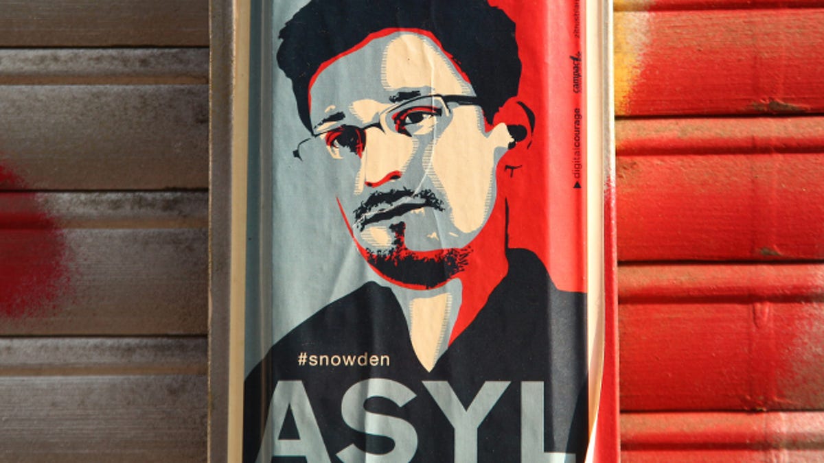 ​A sticker in Berlin, demanding asylum for Edward Snowden. The European Parliament has passed a symbolic resolution saying the NSA leaker should be protected from extradition to the US.