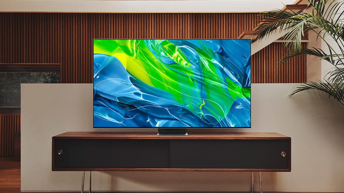 A Samsung QS95B OLED TV on a stand