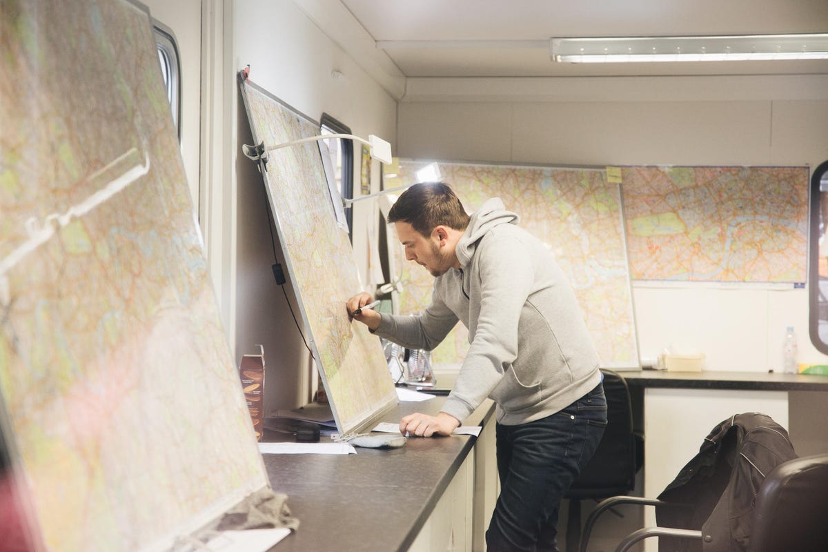 Hopeful cabbie Joe Pearson draws a run through London on a map at the Sherbet Knowledge School. 