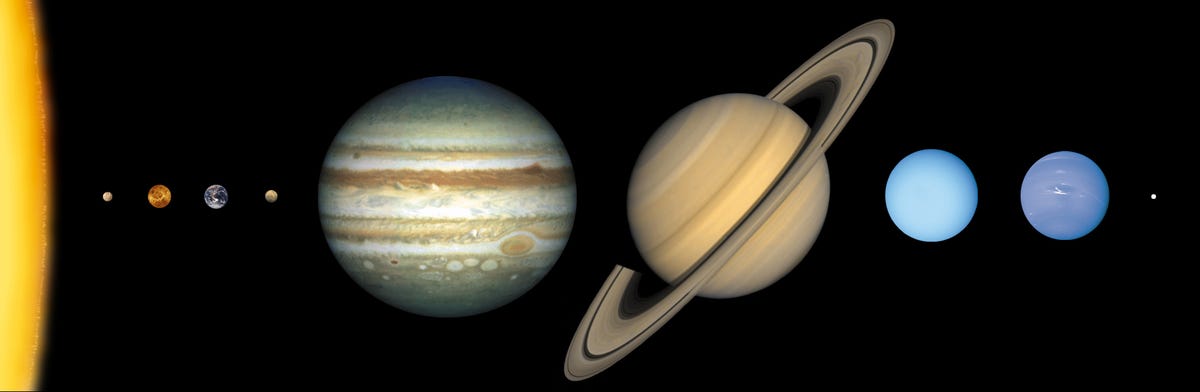 A sliver of the sun is seen on the left side of this image, and all of our solar system's planets are laid out from left to right. Jupiter looks absolutely gigantic compared to the Earth.