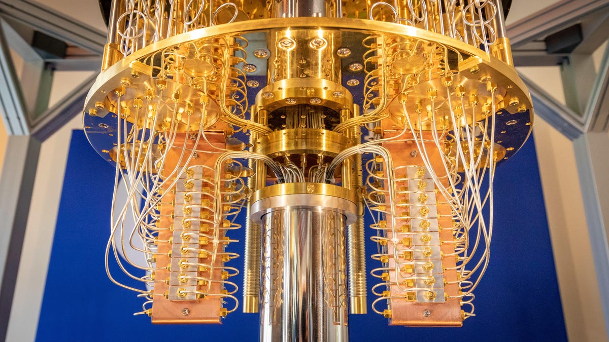 Loops of gleaming golden cables carry data signals inside an IBM quantum computer