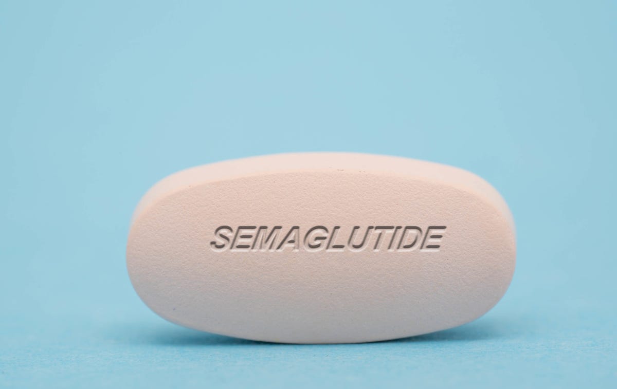 A pill on a light blue background