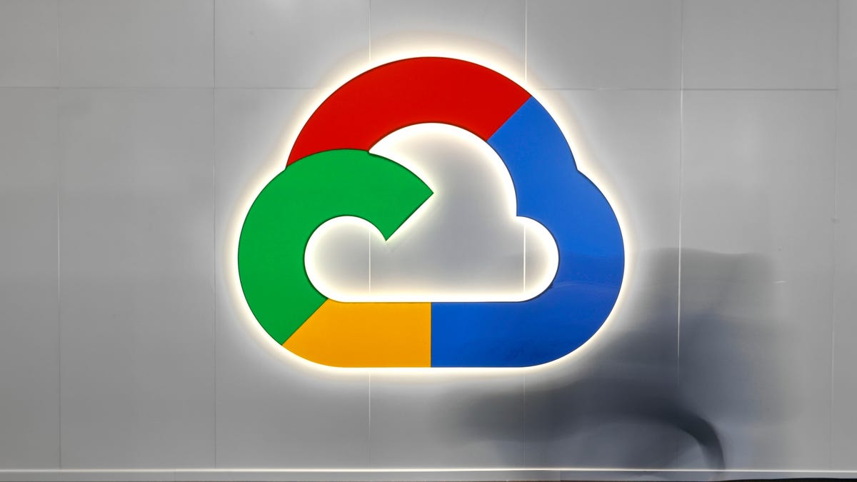 illuminated metal google cloud logo on a wall