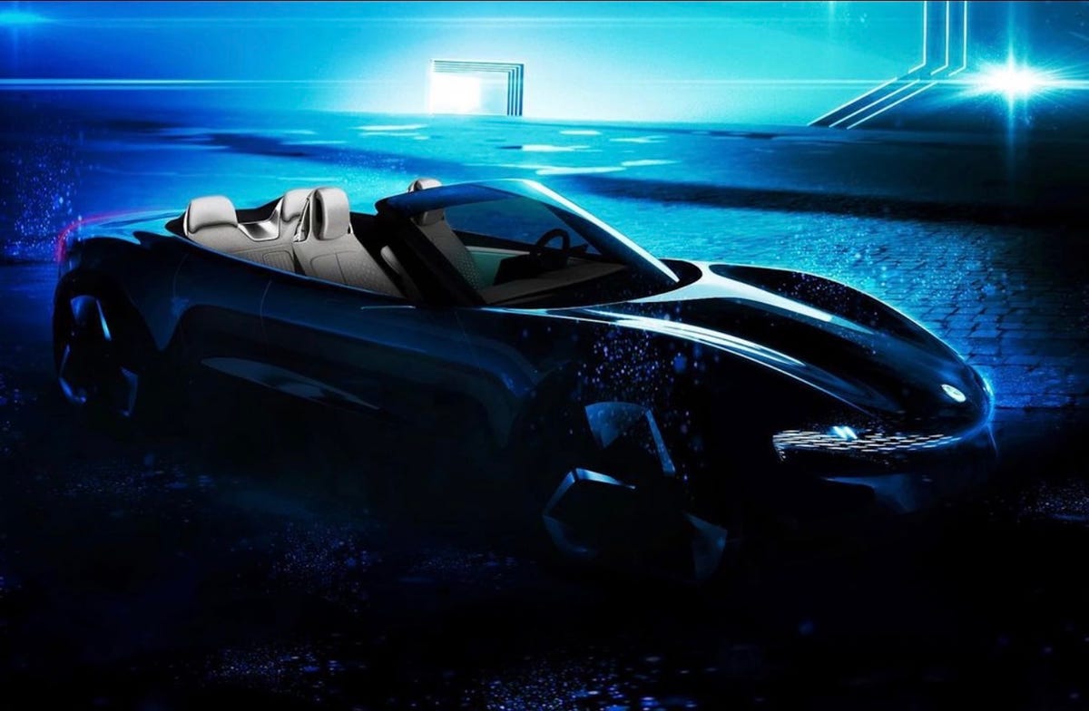 a teaser image of the Fisker Ronin EV, a dark convertible sports car against a blue background